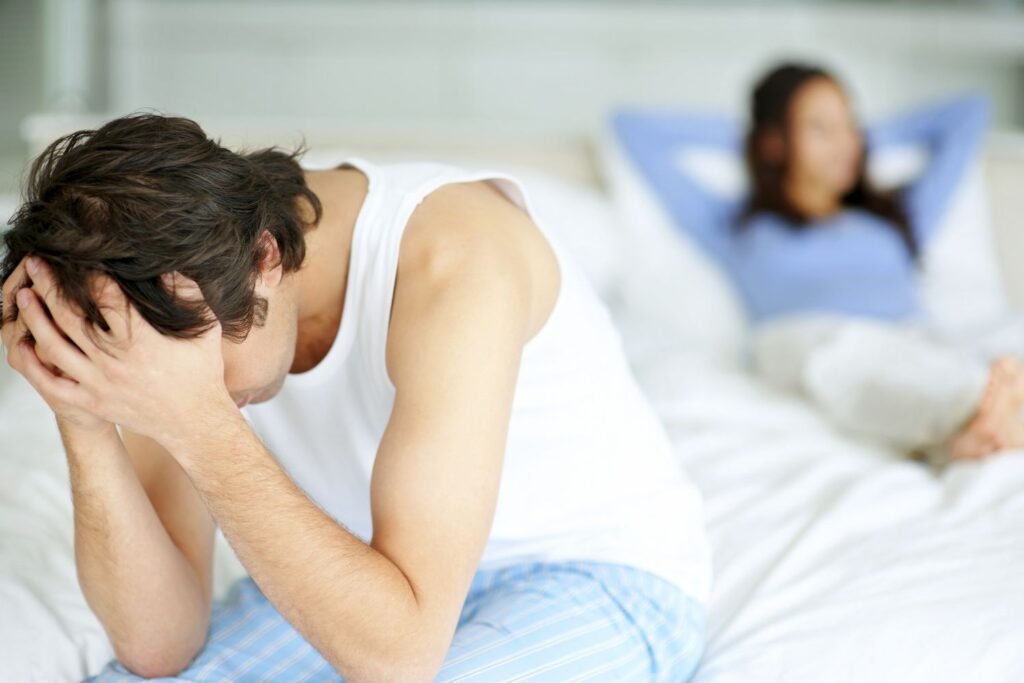 frustrated man sitting on edge of bed 105781757 588d37a83df78caebc0aef0f